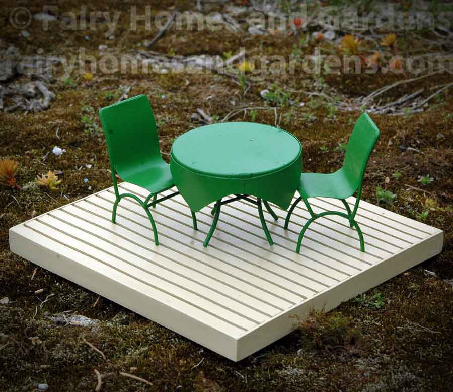 Fairy Garden Deck Shown with Green Cafe Table and Chairs