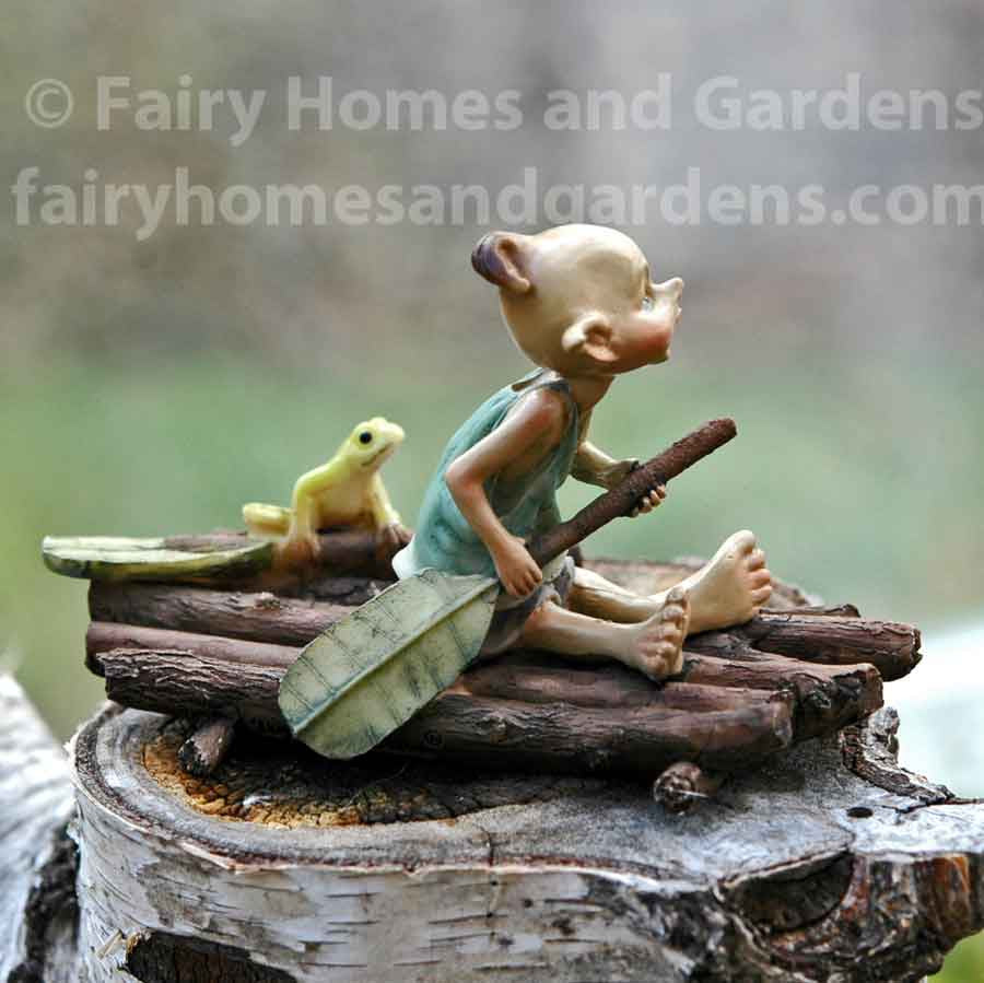 Miniature Pixie Rowing a Raft with Frog Side View
