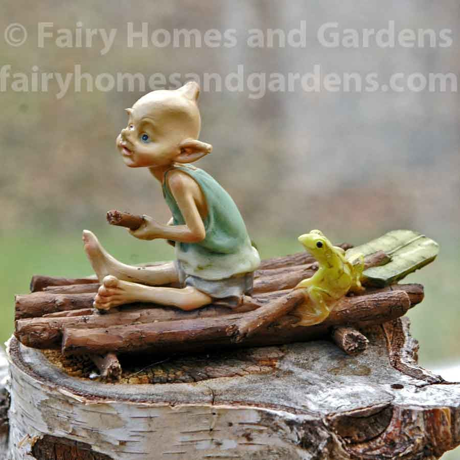 Miniature Pixie Rowing a Raft