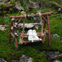 Miniature Loving Rabbits on Swinging Garden Bench