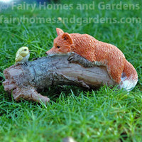 Playful Fox with Bird Figurine