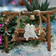 Miniature Rabbits on Garden Swing