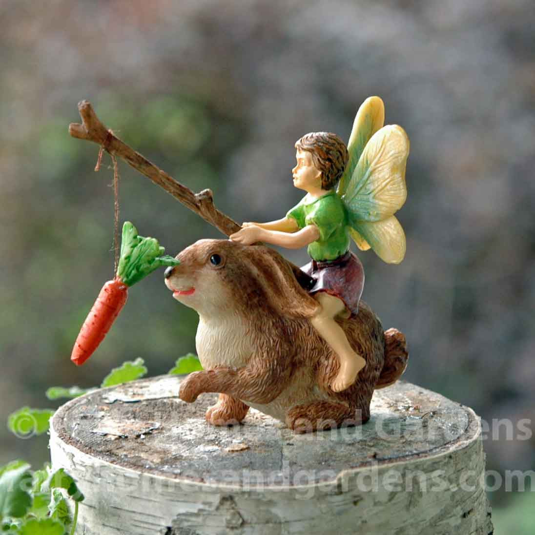 Little Boy Fairy Motivating a Rabbit with Stick and Carrot
