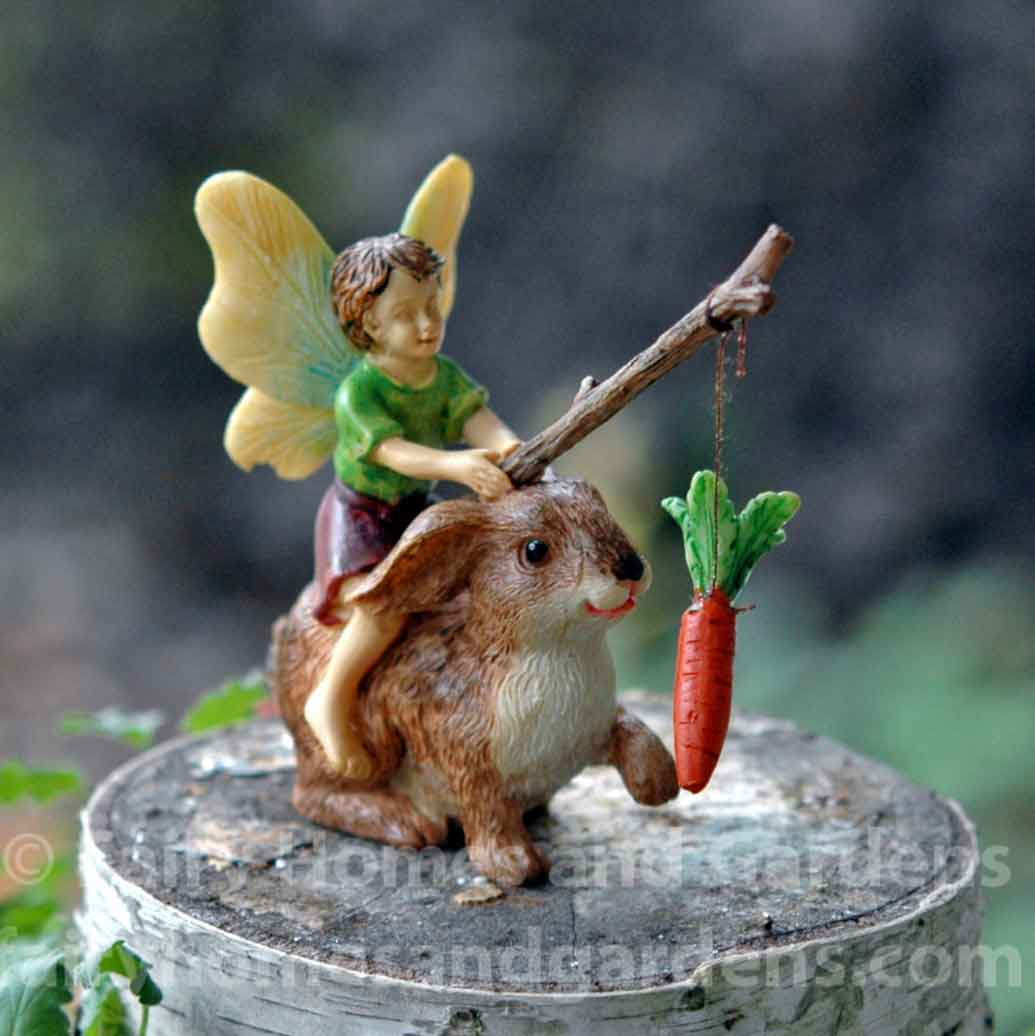 Little Boy Fairy Motivating a Rabbit with Stick and Carrot