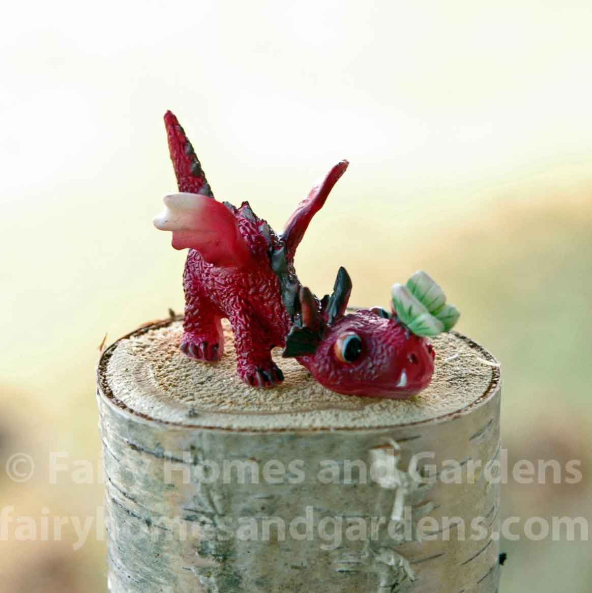 Miniature Baby Red Dragon with Tiny Green Butterfly on His Nose