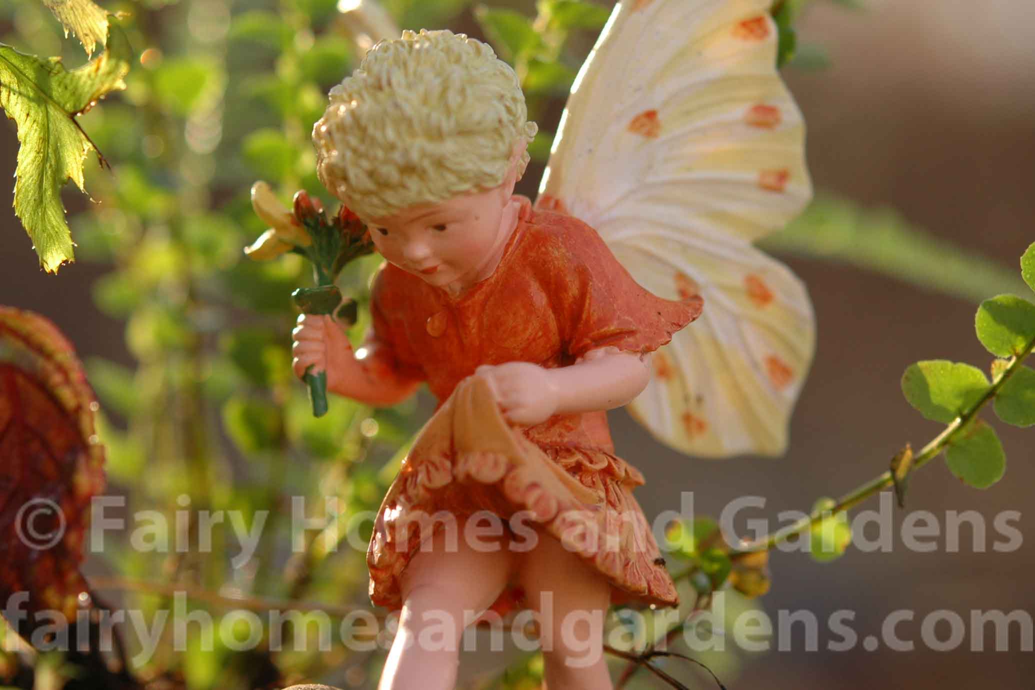 close up of fairy in terrarium